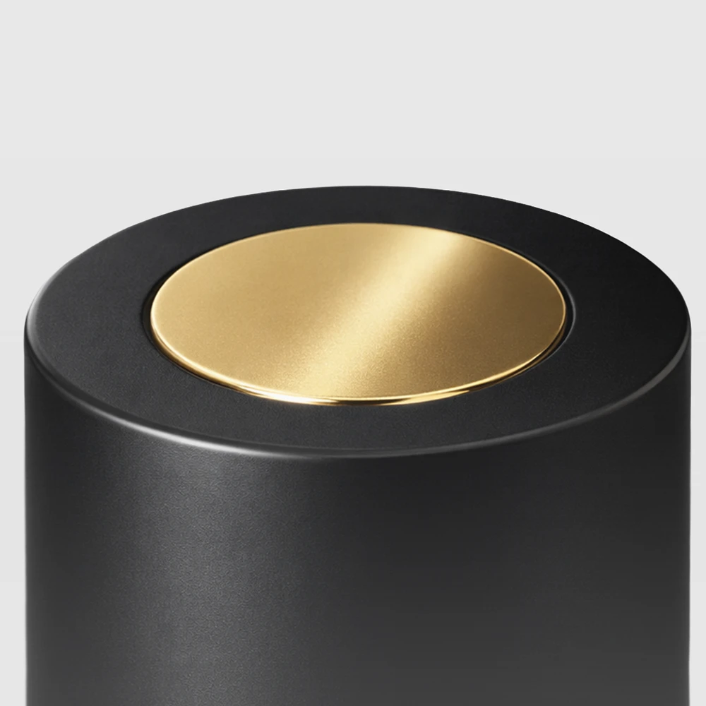 Black cylinder cap with gold disc